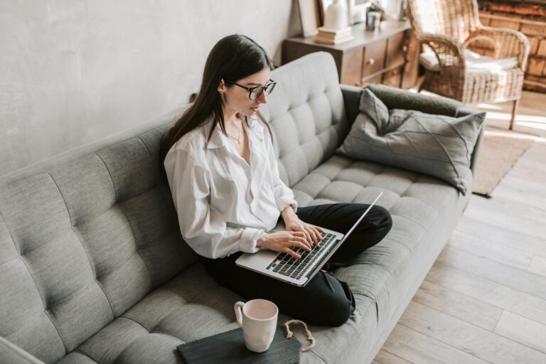 Young woman working on a laptop while planning her career path in her 20s