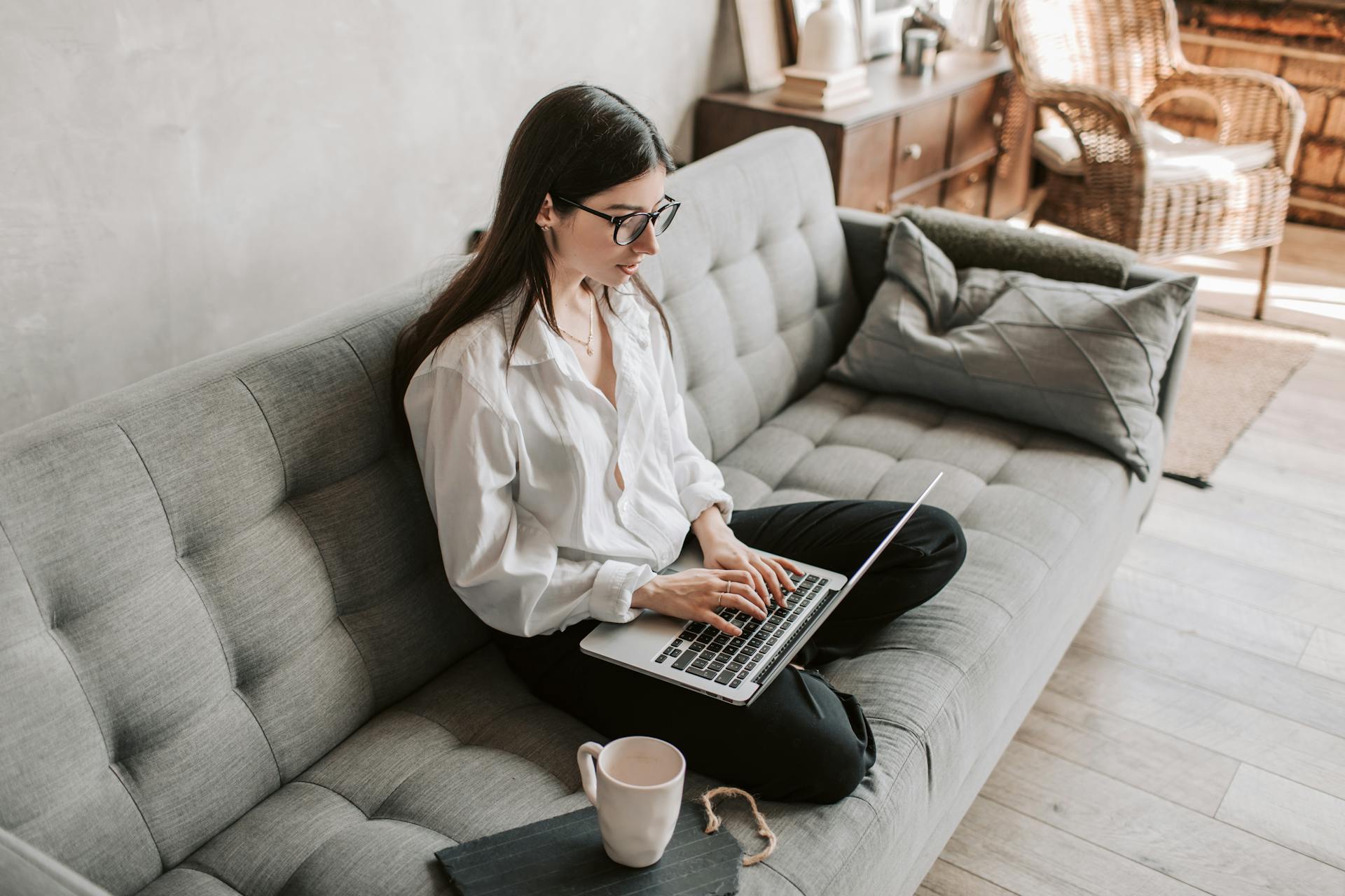 Young woman working on a laptop while planning her career path in her 20s