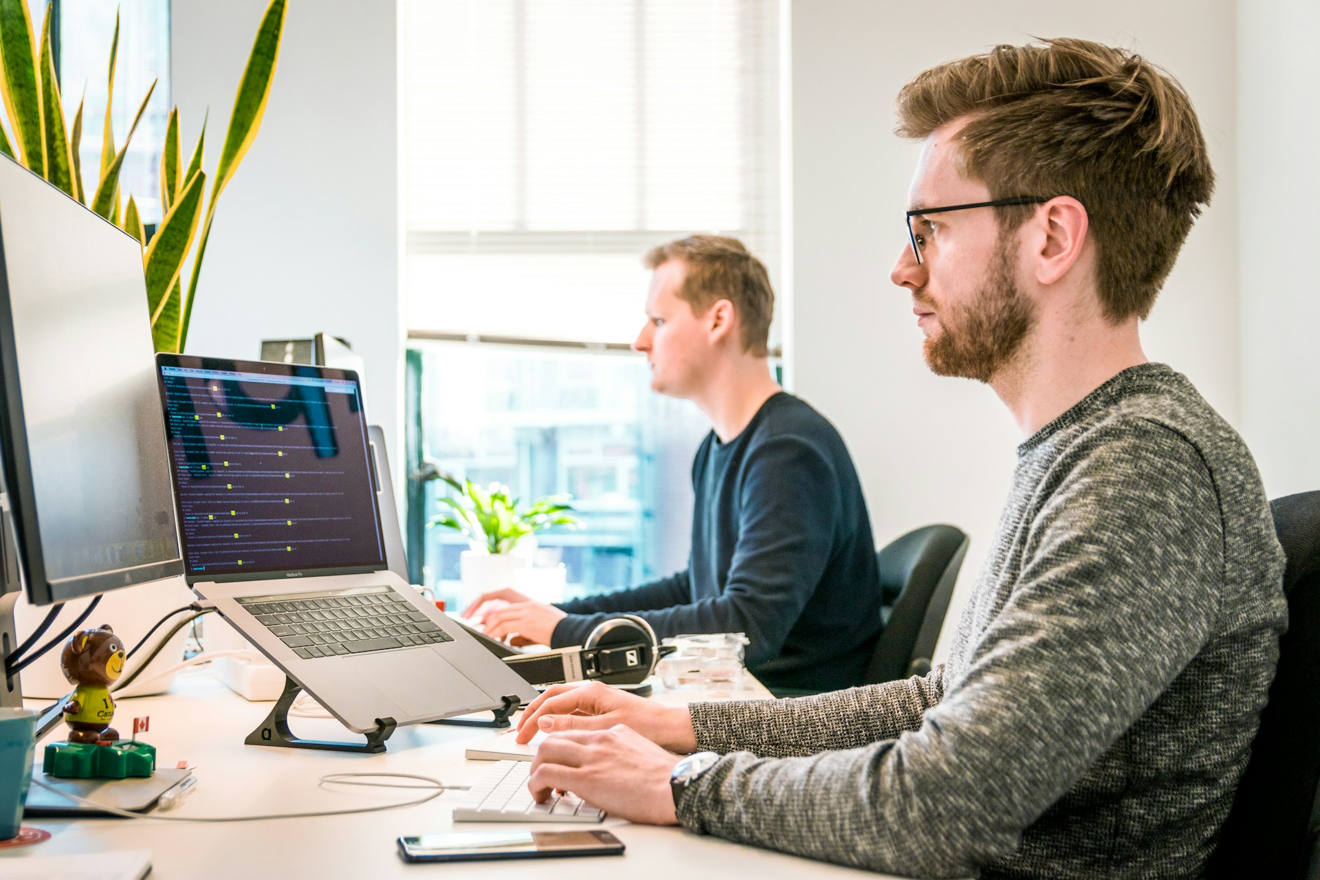 Young professionals working in an office setting, representing early-career opportunities