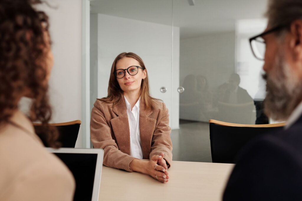 A job candidate discusses salary with hiring managers during a job interview.